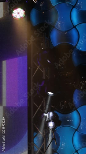 Spotlights in the concert hall. Stage light with colored spotlights and smoke.