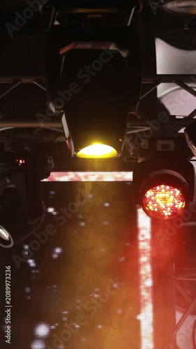 Spotlights in the concert hall. Stage light with colored spotlights and smoke.