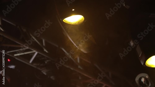 Spotlights in the concert hall. Stage light with colored spotlights and smoke.