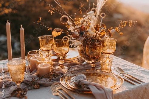 Autumn Wedding Table Setting With Candles And Amber Glassware