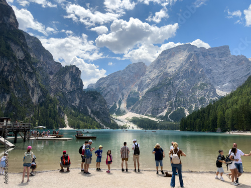 Bild auf Leinwand People visiting lago di braies in italian dolomites