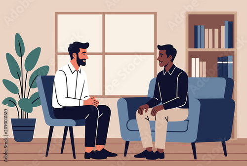 Professional therapist talking to a male client during a counseling session in a comfortable office setting with a plant.
