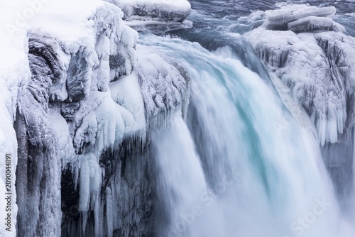 Godafoss waterfall, icy and snowy rock face, Northern Iceland Eyestra, Iceland