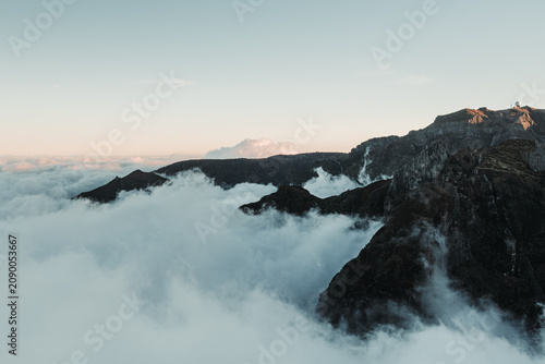 Sunset over the mountains. Mountains shrouded in clouds