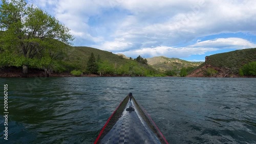 Immersive POV kayaking across Horsetooth Reservoir in Fort Collins, Colorado, while paddling into a strong headwind. Experience challenging summer conditions as a carbon fiber kayak cuts through waves
