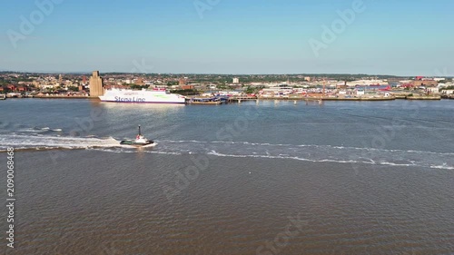 Tugboat Sailing Across River Mersey Liverpool Aerial View