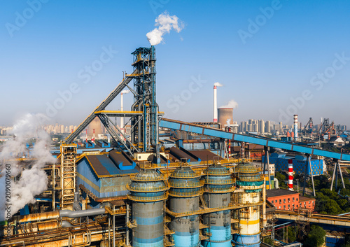 Wuhan steel plant, featuring a complex geometry of massive blast furnaces and intricate pipelines. It reflects China's industry and economy evolution, while driving a sustainable green transition..	