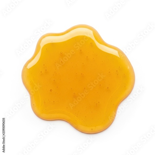 Golden Honey Drip Splatter Isolated on White Background.