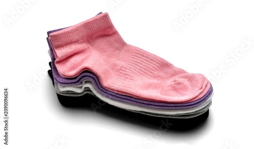 Fotografie Photo of a neat stack of colorful low-cut ankle socks, a multi-colored pack of five casual trainer socks including pink, purple, white, grey, and black, isolated on white background