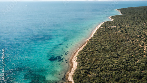 Konstfotografi Rugged Mediterranean coastline with turquoise sea, rocky shoreline and low scrub
