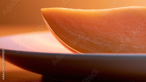 Close-up of a golden spoon with warm light