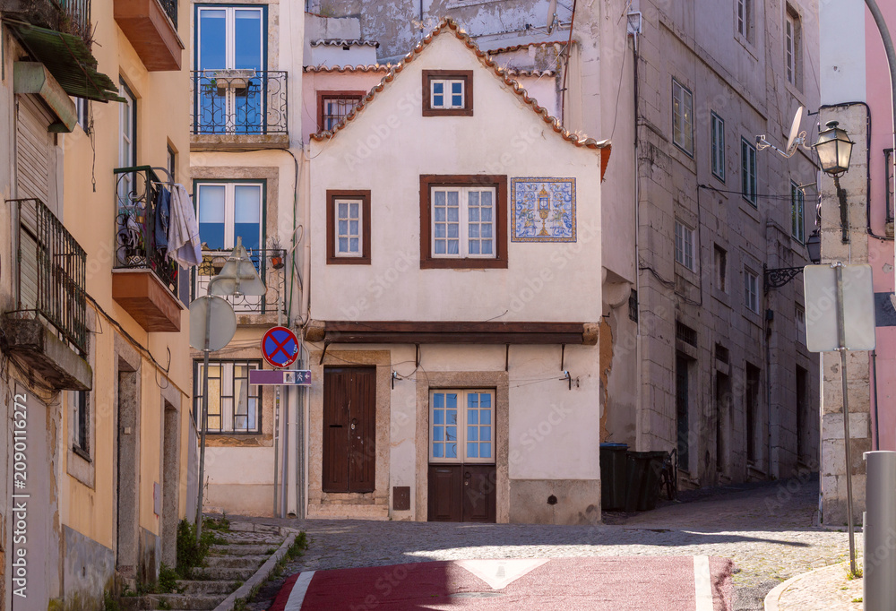Fototapeta premium Traditional Historic House on Narrow Street in Alfama District Lisbon Portugal
