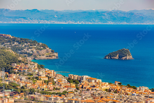 Aerial panoramic view of the coast of Spotorno, Bergeggi Island, Torre del Mare, Liguria, province of Savona, Italy. Riviera dei Fiori. Western Riviera. Ligurian Sea