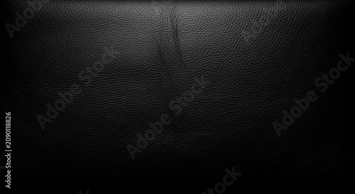 Close-up texture of dark leather material showing natural grain and subtle wrinkles. Ideal for backgrounds, design projects, fashion presentations, or luxury product displays.