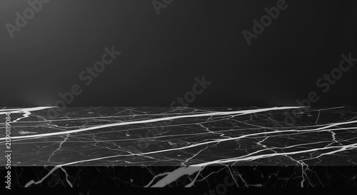 Dark marble surface with white veining and cracks creating an elegant, luxurious texture. Perfect for backgrounds, design projects, interior décor inspiration, or premium displays.