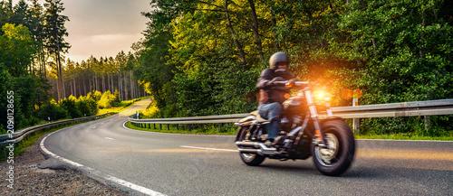 blurred motorbike on the road riding. having fun riding the empty road on a motorcycle tour / journey