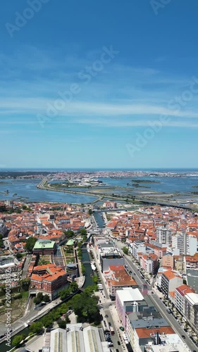 Wide drone view of Aveiro city center, river canals and traditional boats