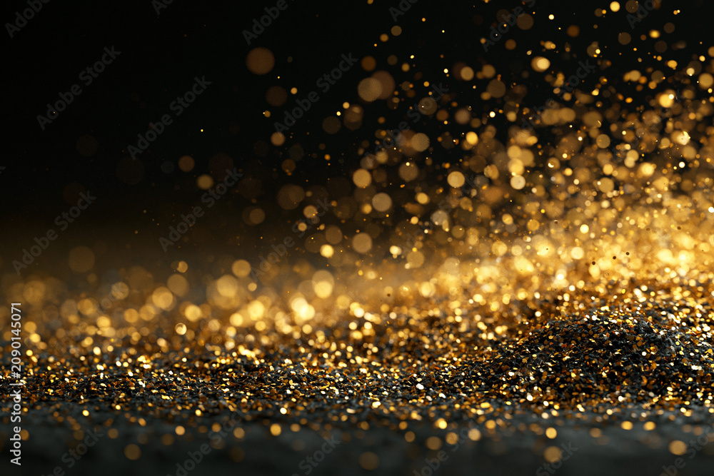 Fototapeta premium Luxury gold glitter and sparkle bokeh on black background