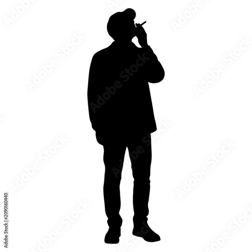 фотографія Silhouette of a Man Smoking a Cigarette.