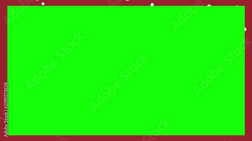 Green screen surface displays a deep red border frame accented by scattered white sparkles along the top edge for creative media projects.