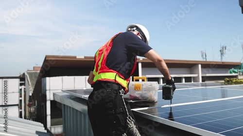 Technician installing rooftop solar panels for green energy, supporting renewable energy, clean power, sustainable technology and solar infrastructure.