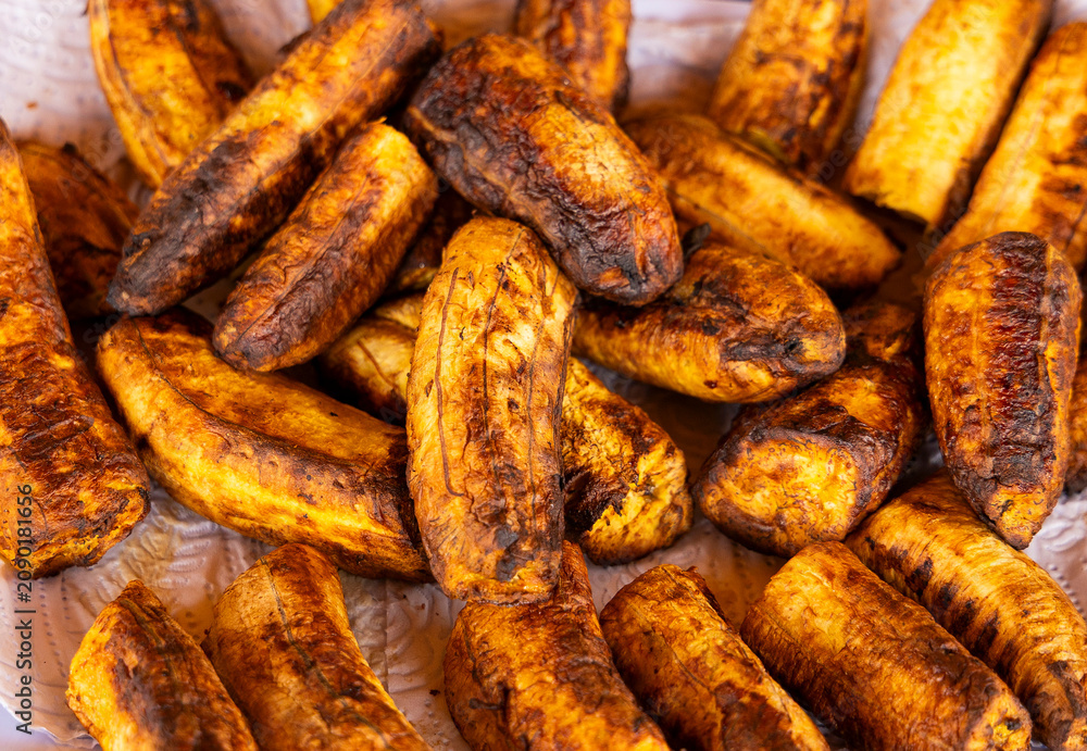 Fototapeta premium A generous portion of roasted ripe plantains, a traditional Colombian dish.