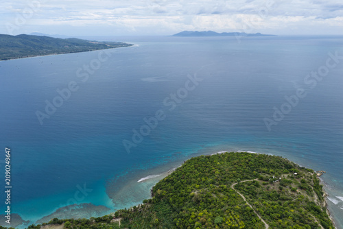 Aerial View of Green Peninsula in Krueng Raya Bay with Weh Island on the Horizon in Aceh, Sumatra