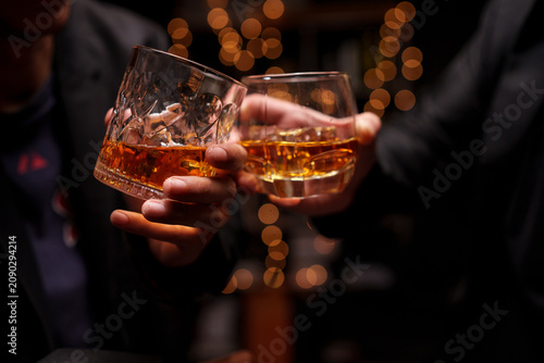 Toasting with Whiskey in a Celebration Night