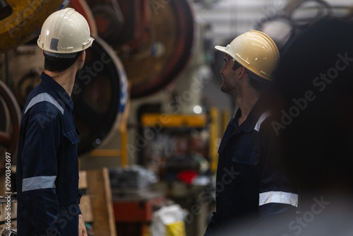 Cuadro en lienzo serious man worker engineer wearing safety hardhat and coverall performing inspe