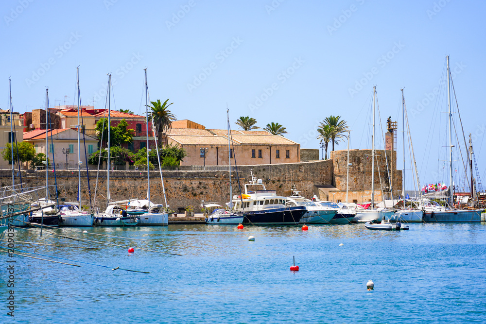 Obraz premium Historic city walls and harbor of Alghero, Sardinia, Italy