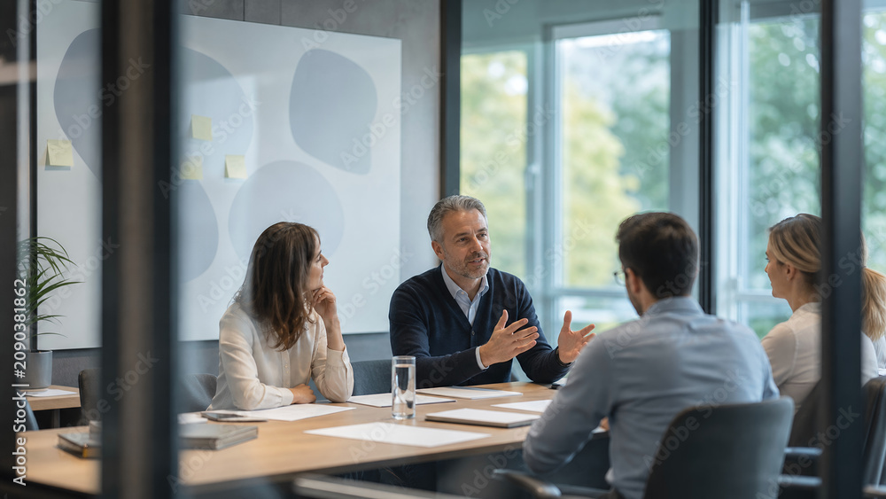 Fototapeta premium Corporate Finance Meeting Seen Through Glass