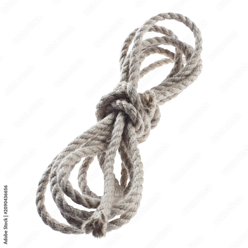 Obraz premium Coiled natural cotton rope tied in the center, isolated on cutout transparent background
