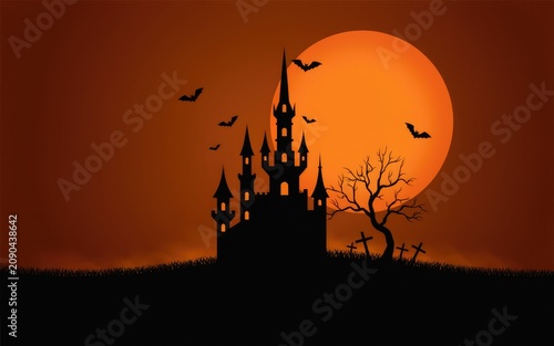 Haunted castle silhouette under a full moon at night