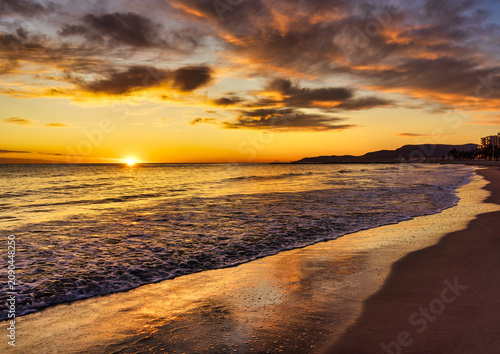 Landscape with a beautiful sunset on a quiet beach