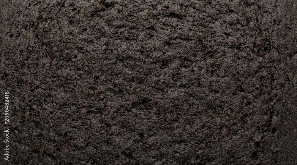 Fototapeta premium Dark Chocolate Cake Texture Background Close Up Macro Shot of Porous Brownie Surface for Food Photography and Culinary Design Projects
