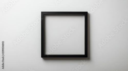 Empty black picture frame on white background.