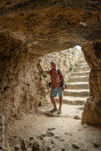 Fotografie Male traveler visiting archaeological ruins of ancient Paphos in Cyprus