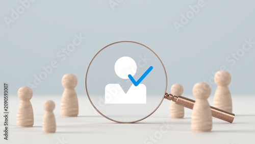 Bild auf Leinwand Wooden figures standing around a magnifying glass examining a selected user prof