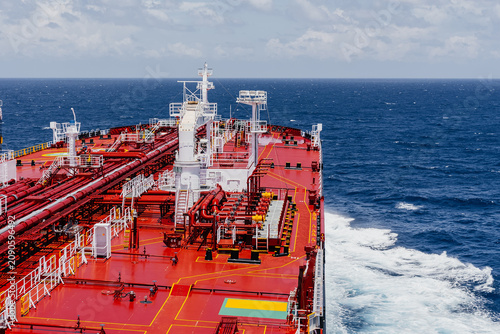 Obraz na płótnie Large oil tanker sailing on open sea under blue sky