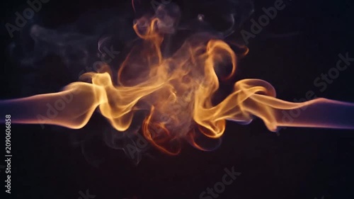 Abstract golden smoke swirls against a deep black background