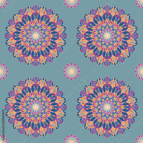 Elegant seamless mandala with layered floral petals in purple, blue, and peach on a soft blue background. Perfect for textiles, wallpaper, apparel, packaging, home décor, and stationery.