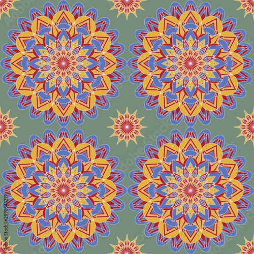 Seamless geometric floral mandala with bold blue, gold, and red layers on a soft sage background. Ideal for fabric, wallpaper, home décor, stationery, gift wrap, and surface design.
