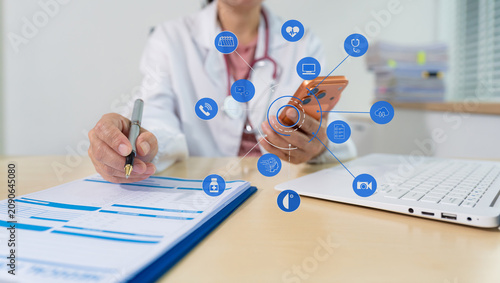 Medical students working with tablets and hospital documents