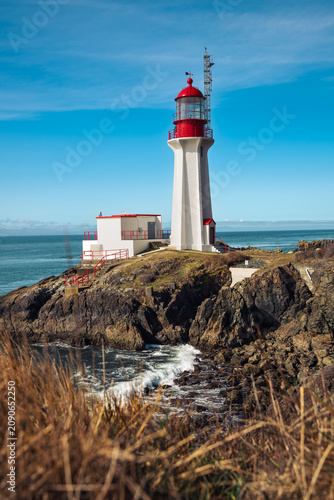 Coastal Lighthouse Standing on Rugged Rocky Shore