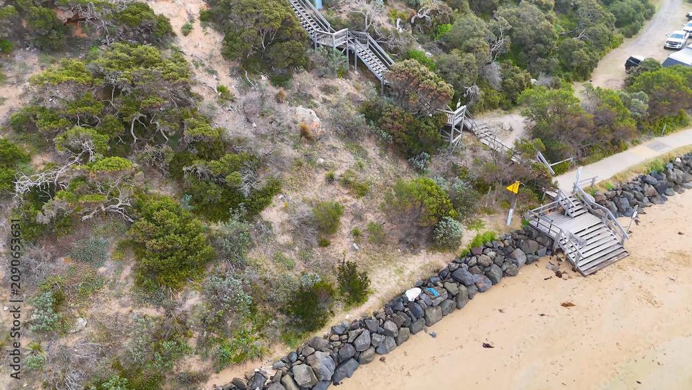 Naklejka premium Aerial View of Wooden Coastal Stairs and Beach at Barwon Heads