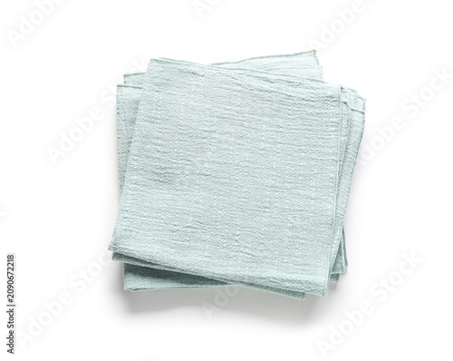 Stack of folded light blue ...