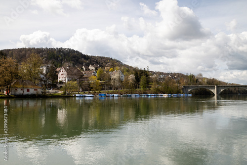 Picturesque riverside village of Eglisau, Switzerland, with historic architecture and boats