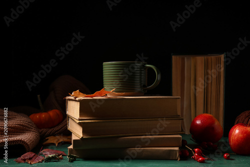 Books with cup of tea, appl...