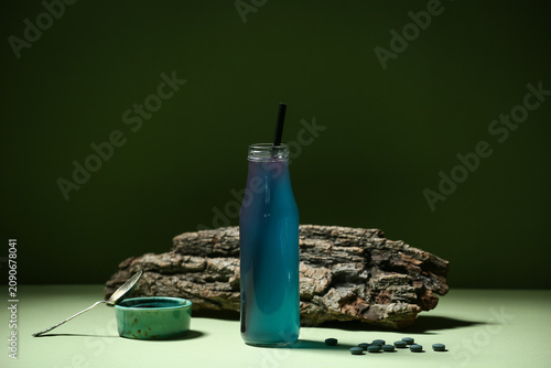 Bottle of spirulina drink w...