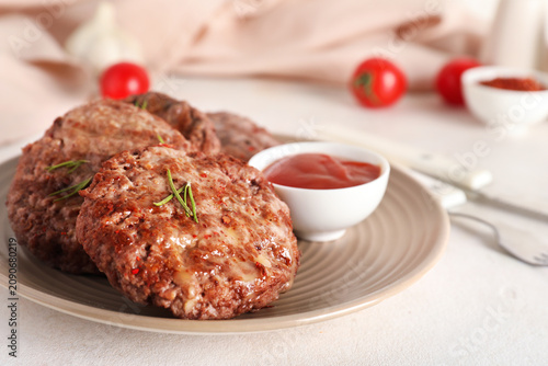 Plate with tasty meat cutle...
